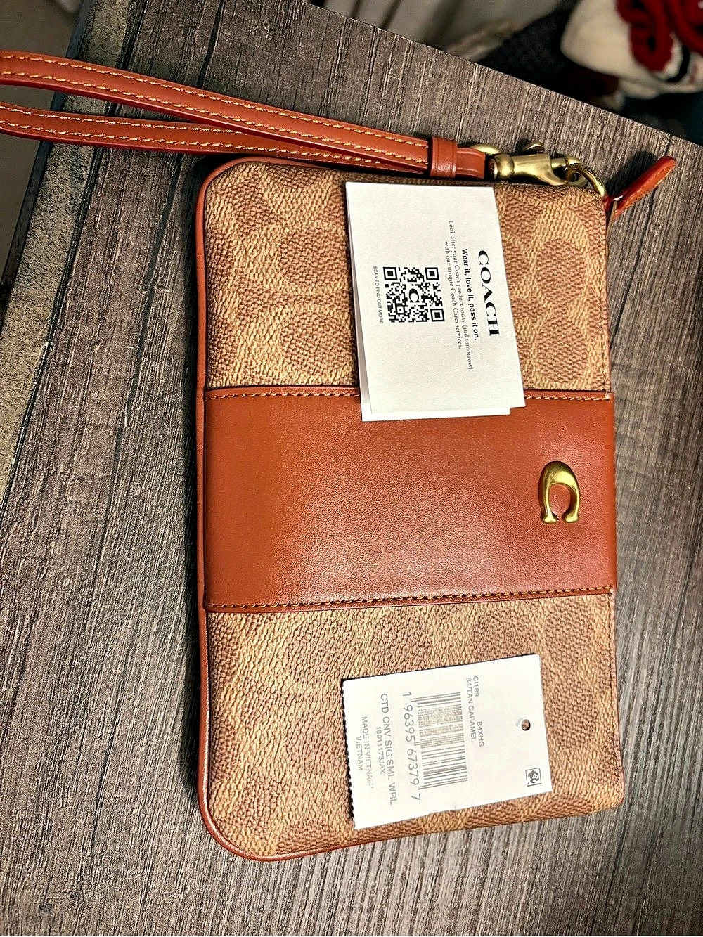 Coach Retail Essential Small Wristlet In Signature Canvas Signature Canvas Brown